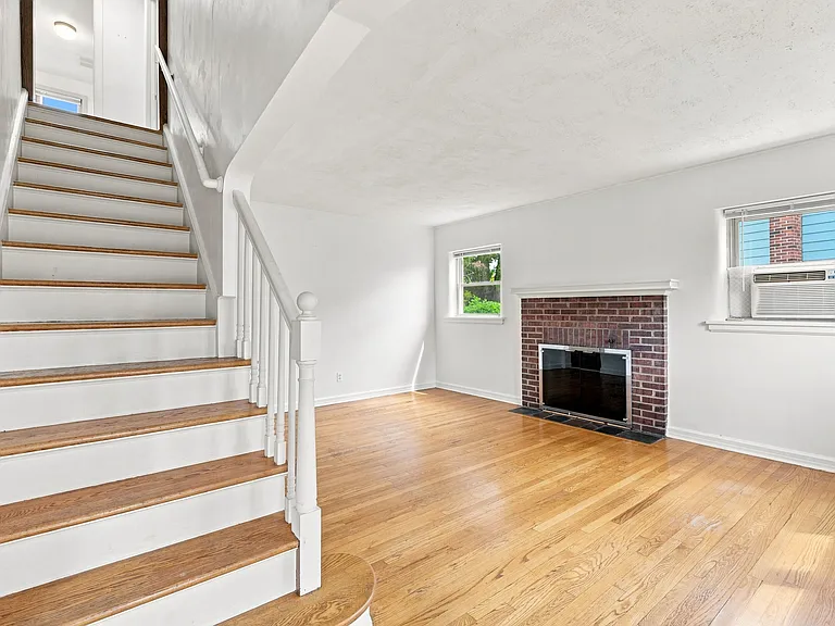 living room with wood burning fire place
