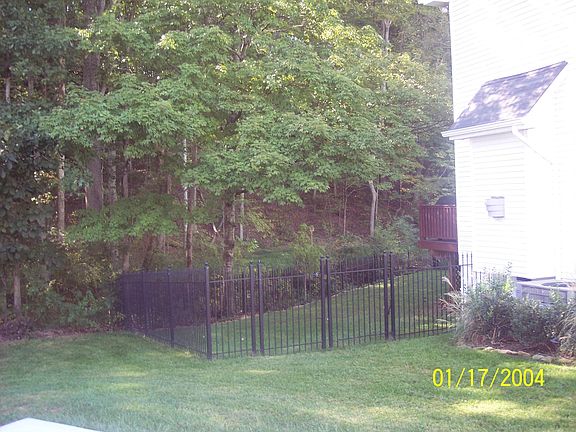 Wrought Iron Fence encloses Backyard and Pool