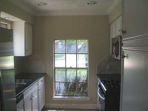 Kitchen with New Appliances, Granite Cabinets and Ceramic Tile Floors