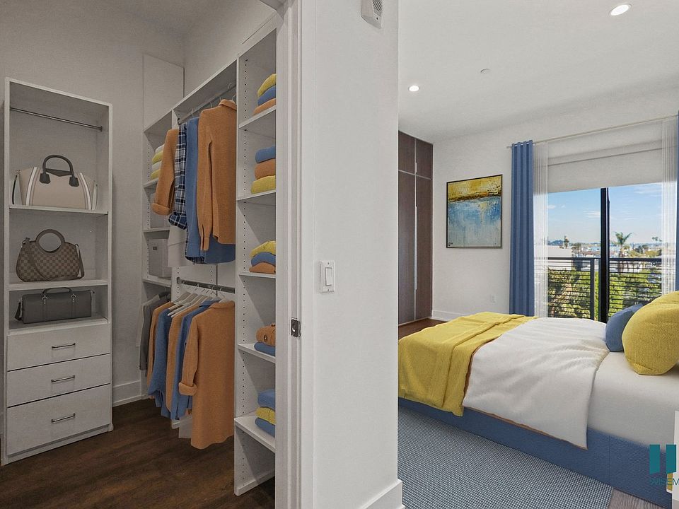Bedroom with Walk-In Closet, Built-In Cabinets, and Balcony