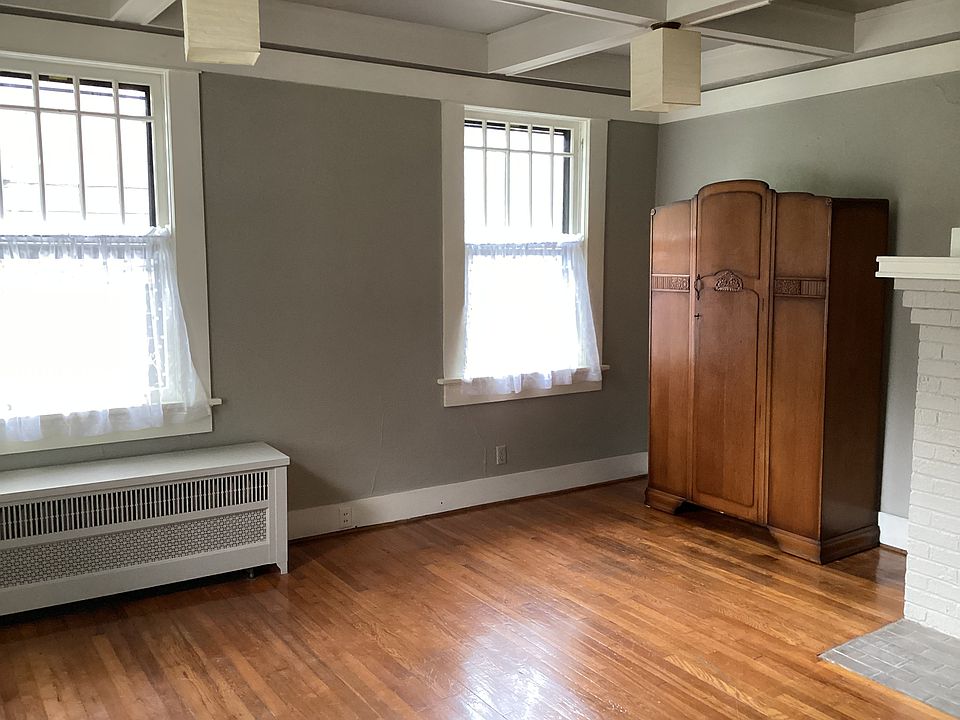 Bedroom with large armoire for additional storage.