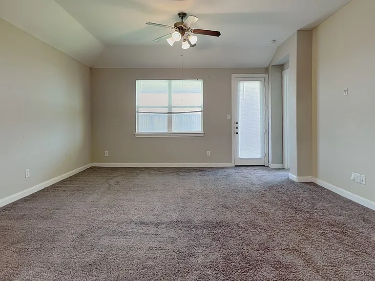 Spacious living room with neut