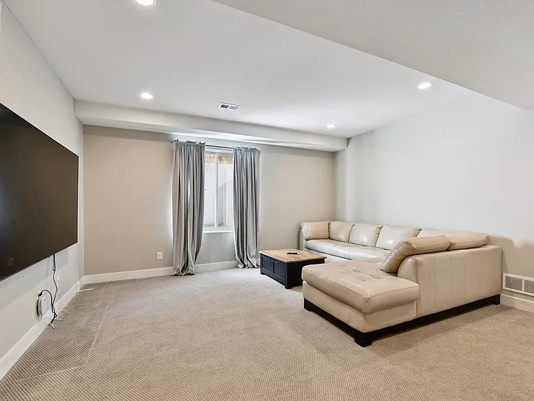 Basement living room offers a perfect spaces for movie and game nights!