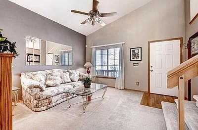 Living room with hardwood floor entry.