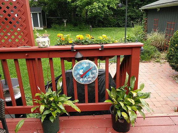 Deck leads to brick patio