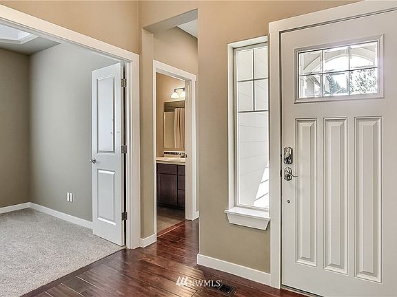 As you enter, powder room and office/bedroom to your right. 