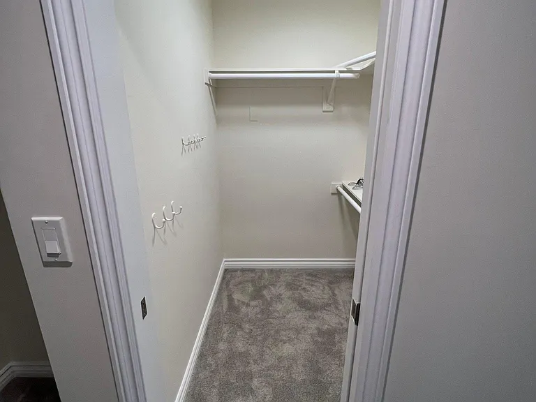 Walk-in closet with pocket door and internet/electric access that can be used as an office.