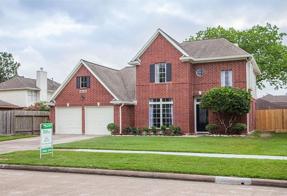 Front elevation of this beautiful; brick home. Notice the addition of shutters and the low maintenance landscaping.