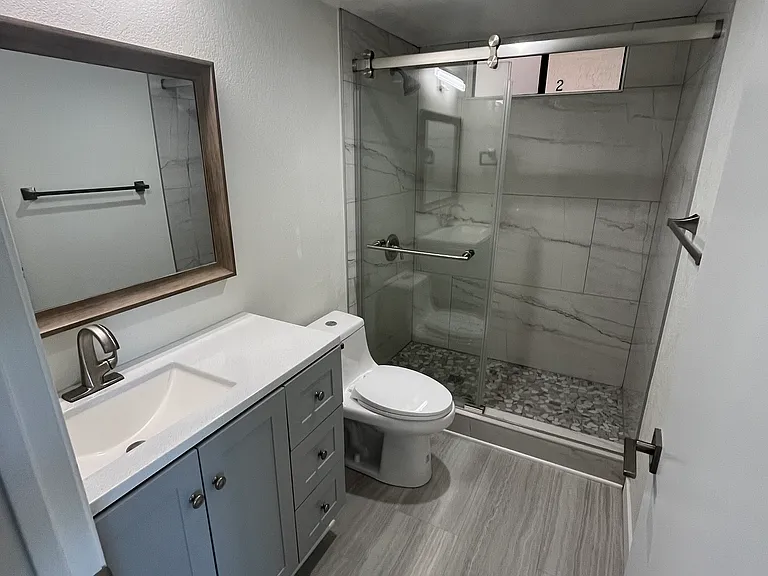 Hallway bathroom with shower