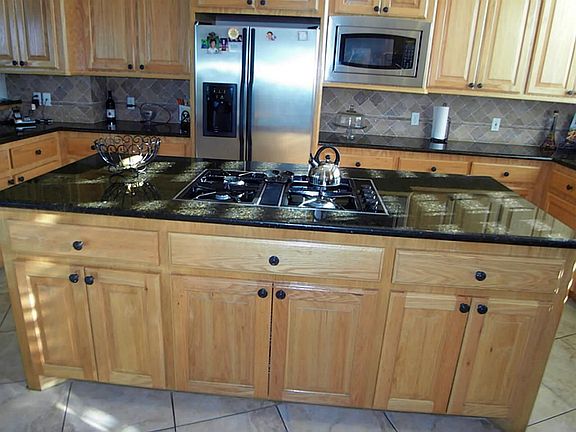 LARGE ISLAND WITH BEAUTIFUL CABINETRY