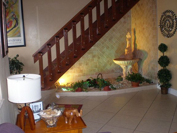 Indoor fountain under staircase