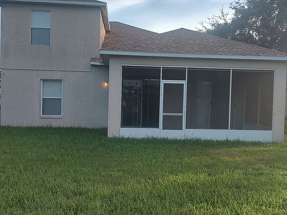 Rear Of The Home With New Patio Screen Enclosure