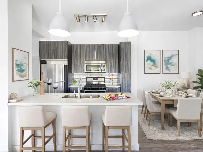 Open kitchen with room for island seating, modern finishes, and a seamless connection to the dining area.