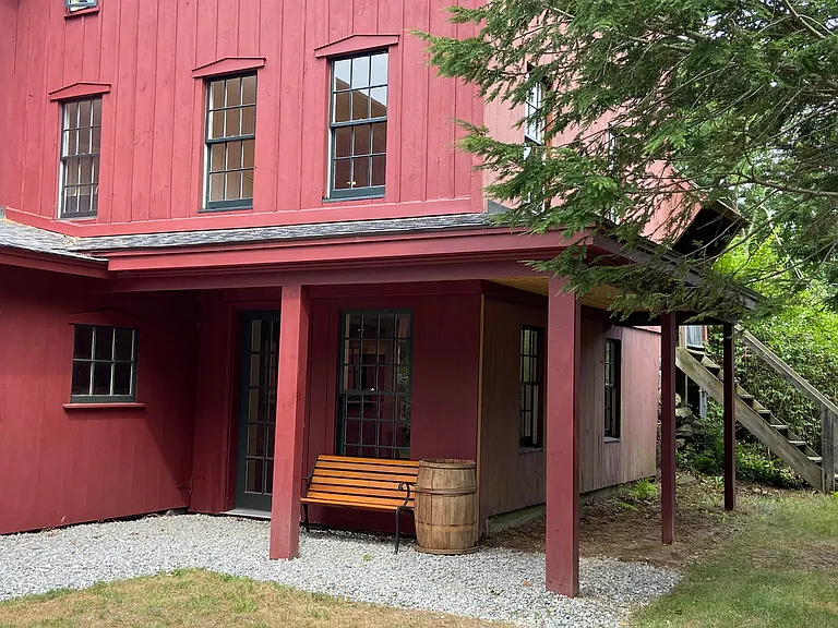 Small covered porch over apartment entrance. Back stairs to another small porch and living room entrance