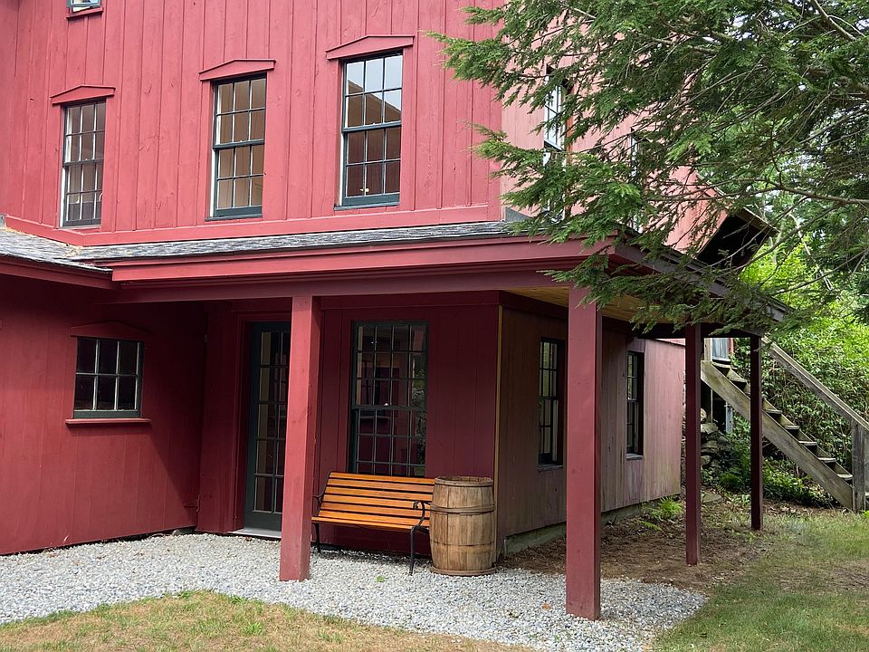 Small covered porch over apartment entrance. Back stairs to another small porch and living room entrance