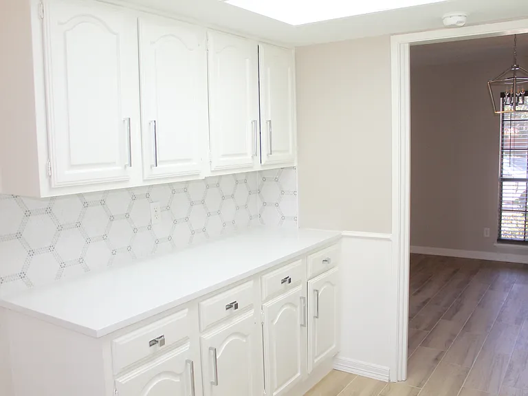 Freshly painted white cabinetry with versatile space. Use it as a wet bar, coffee bar or make it your own