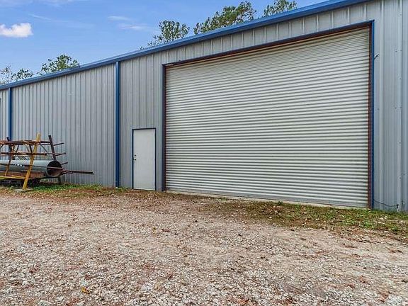 4-20x16 foot overhead doors open to the workshop, easily fits RV, Commercial trucking, completely outfitted with 240/Phase three electric.