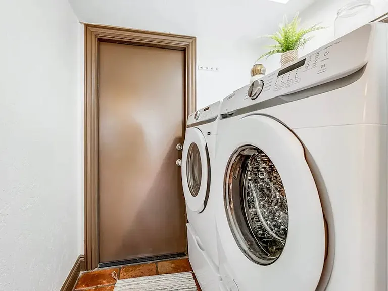 washer and dryer door leads out to garage