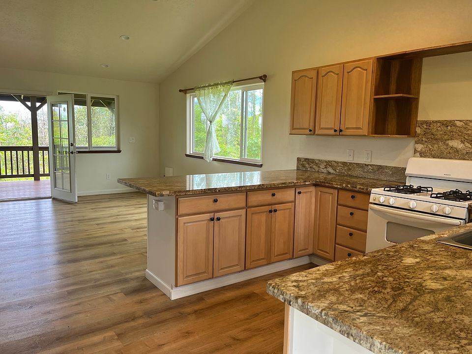 Kitchen has plenty of counter & cupboard space, oven w stove, fridge, and dishwasher.