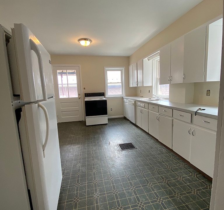 Kitchen with dishwasher, stove, refrigerator and microwave