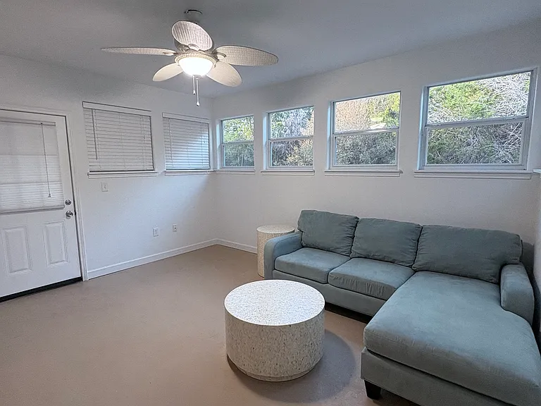 Specious recreational room with view of backyard and wildlife.
