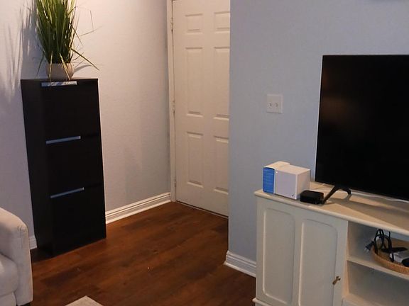 Entry door accessed by key or coded keypad