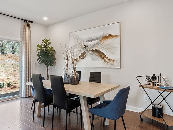 The main-level is perfect for hosting elegant dinner parties or relaxing with family.