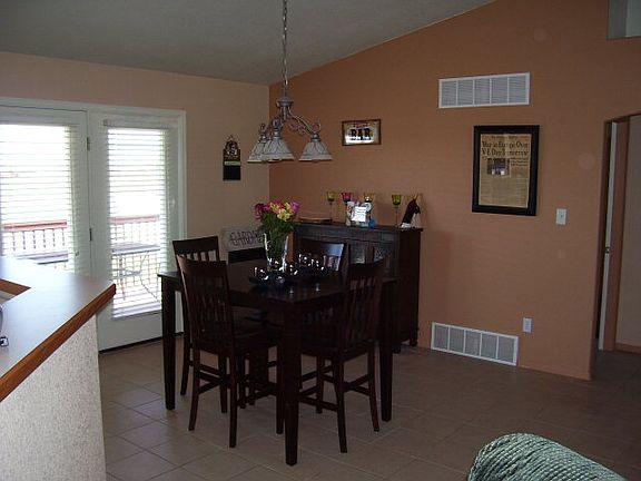 Large eating area with walkout to deck