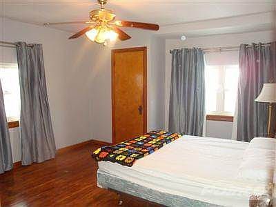 Master bedroom has 2 good size closets, hard wood flooring and ceiling fan with light.