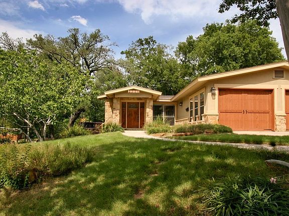 Elevated tree filled corner lot