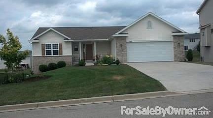 Front of home
						:
						Beautiful landscaping, inviting front porch and concrete driveway