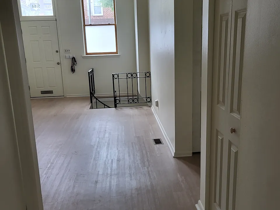 View towards entry and spiral stair to basement. Bathroom on immediate left and two closets on immediate right
