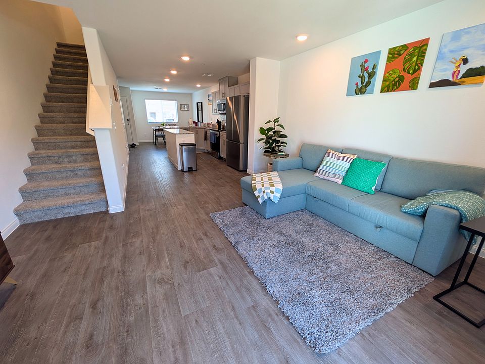 view from living room and opened space to kitchen and dining area , door entrance .