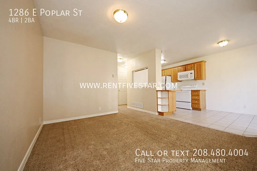 Spacious 4 Bedroom Townhome with Single Car Garage! — Photo 3