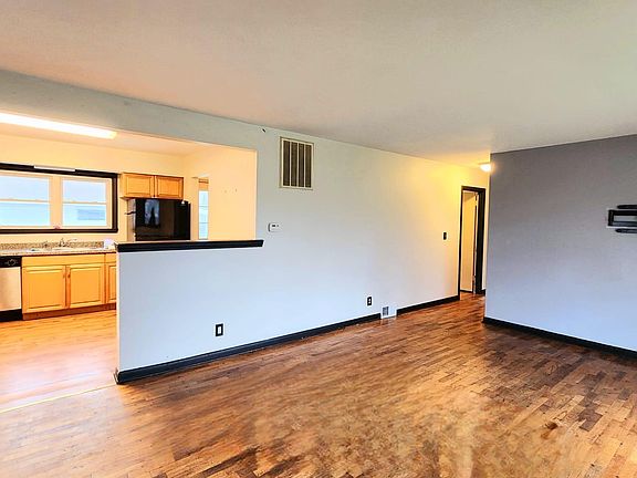 View from entrance. Living room and kitchen.