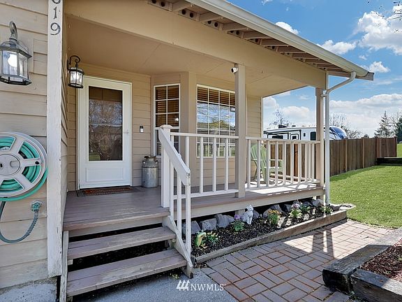 Charming covered porch leads to the front door