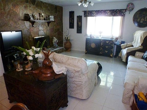 The den or family room is cozy and features a wood burning firep