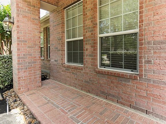 Enjoy time overlooking the front yard under the covered front porch with your neighbors.