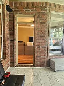 Looking into the living room from the enclosed sunroom