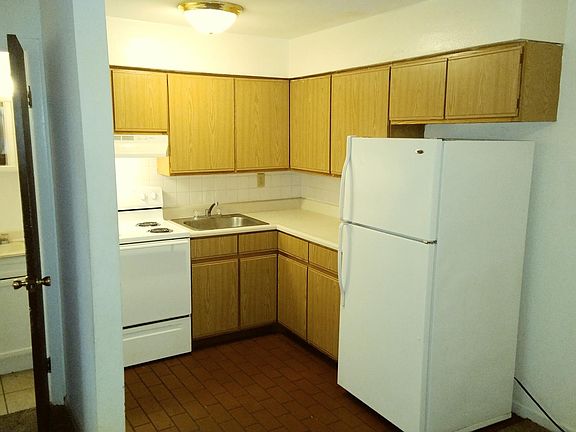 Nice view of the kitchen and half bath from the living/ dining room.