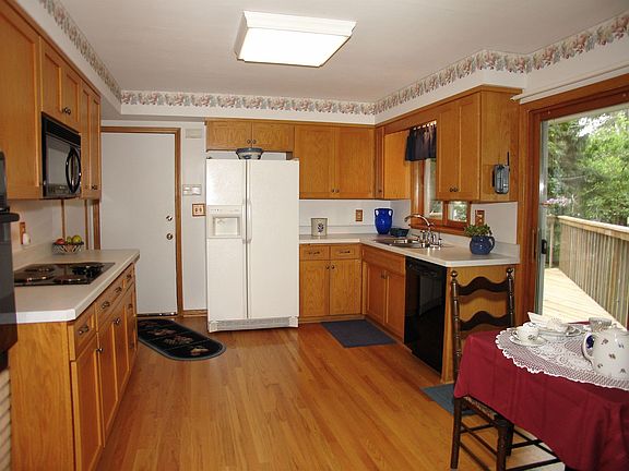 Newer appliances, gorgeous hardwood flooring, eat-in kitchen