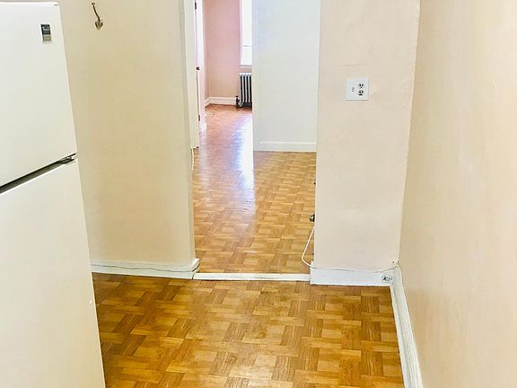 view from kitchen to living room to bedroom
