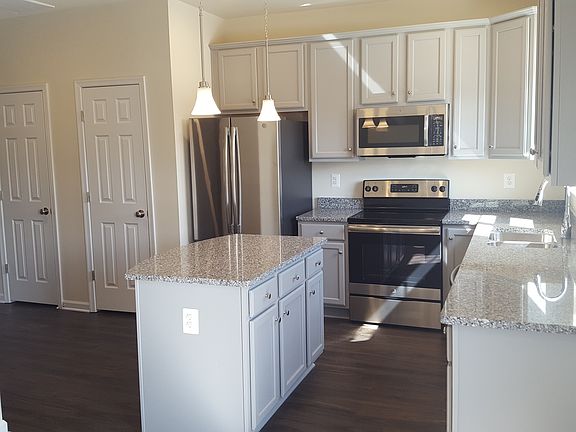 Kitchen with granite countertops and stainless steel appliances