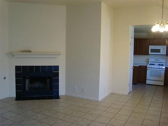 Gas fireplace with mantle.
