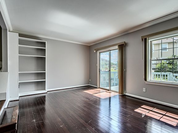 Living Room w/Wood Floors and built in shelves