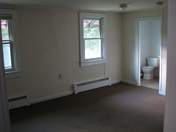 Looking from Kitchen into living room & bathroom.