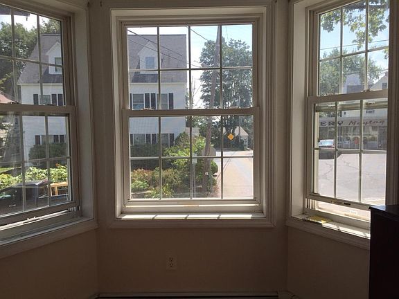 Living room with bay windows.