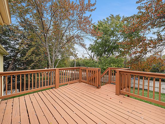 A large deck offers an inviting outdoor space to unwind, host guests, or savor breakfast, combining comfort and fresh-air living in one spot.