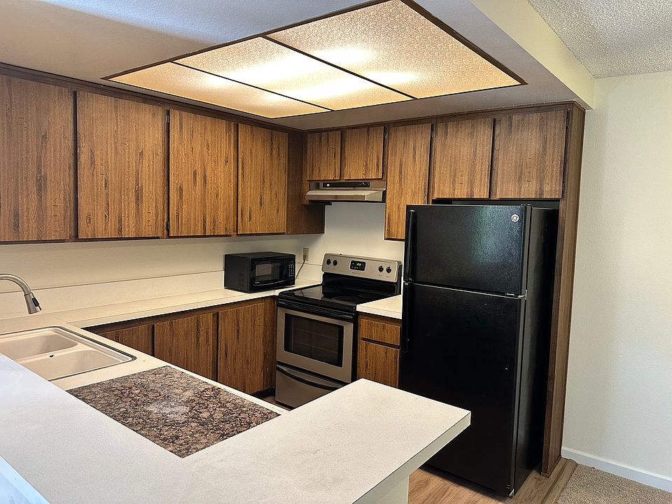 kitchen with fridge, range oven, & microwave