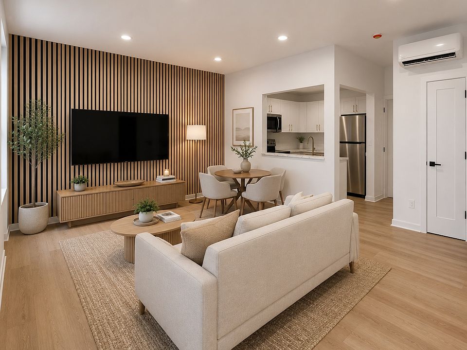 Virtually staged living and dining area showing one possible layout based on the floor plan dimensions. Apartment is delivered unfurnished.
